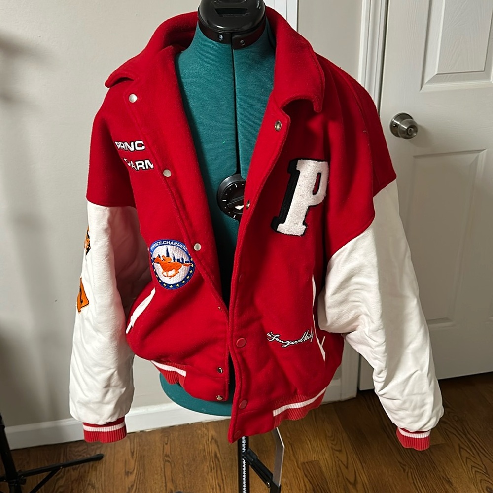 red letterman jacket , says prince charming